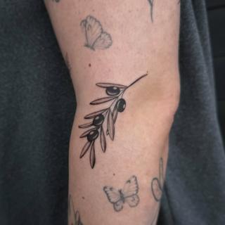 Fine line olive branch tattoo by @tattoosbycay