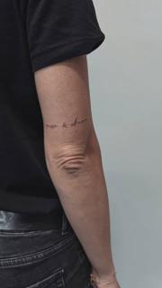 Fine line script lettering tattoo by @terrie_titouutattoo