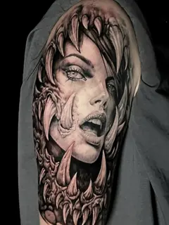 Realism woman with fangs tattoo by @thanos_stokas_tattoo