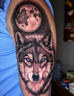 Realism wolf and moon tattoo by @tim_langer_tattoo