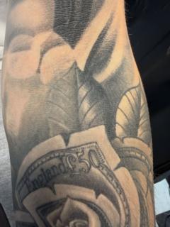 Realism money rose tattoo by @traceless.laser