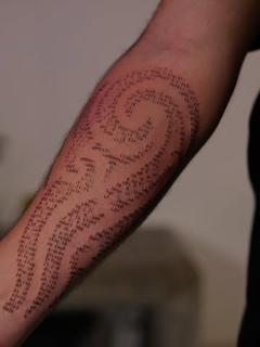 Fine line spiral text tattoo by @tattoovrontis