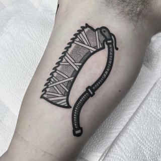 Blackwork abstract scythe tattoo by @anshin_anshin_tattoo