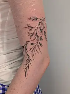 Fine line floral branch tattoo by @xia_smith_tattoo