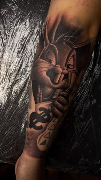 Realism cartoon rabbit tattoo by @filippidis_tattoo
