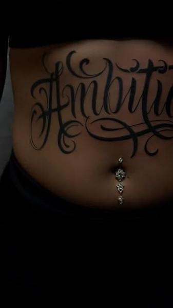 Script ambition script tattoo by @filippidis_tattoo