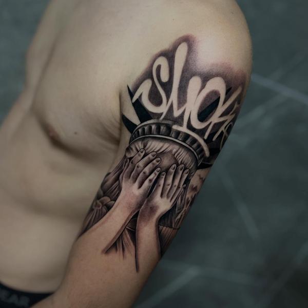 Realism crying statue tattoo by @filippidis_tattoo