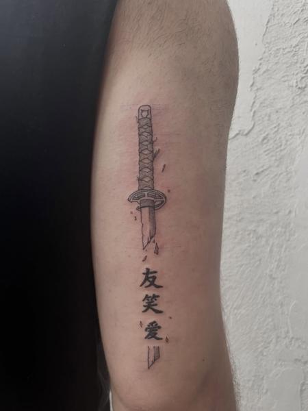 Fine line katana with kanji tattoo by @ilias_nyxta