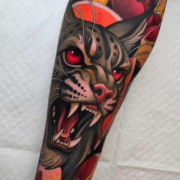 Traditional fierce cat tattoo by @_hamiltontattoo