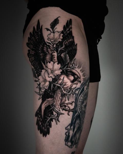 Blackwork hawk and flowers tattoo by @_laurafey_