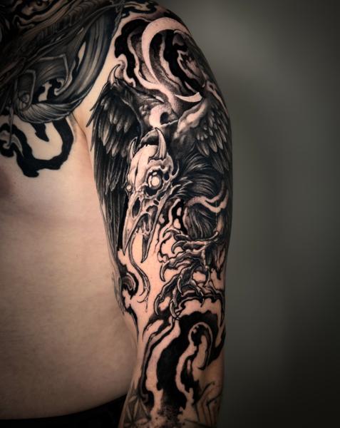 Blackwork raven skull tattoo by @_laurafey_