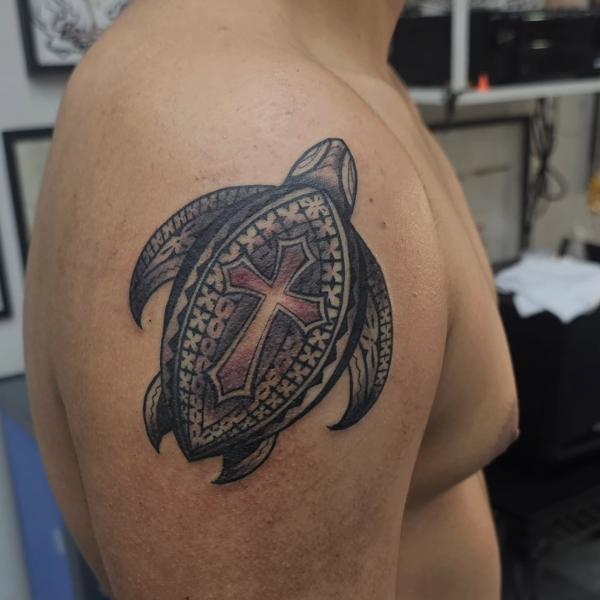 Traditional turtle with cross tattoo by @_lordmayortattoos