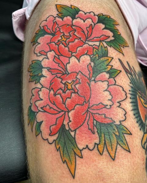 Traditional floral design tattoo by @a_crockertattoo