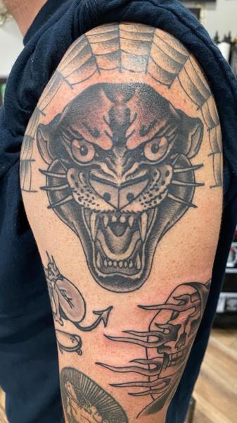 Traditional panther head tattoo by @a_crockertattoo