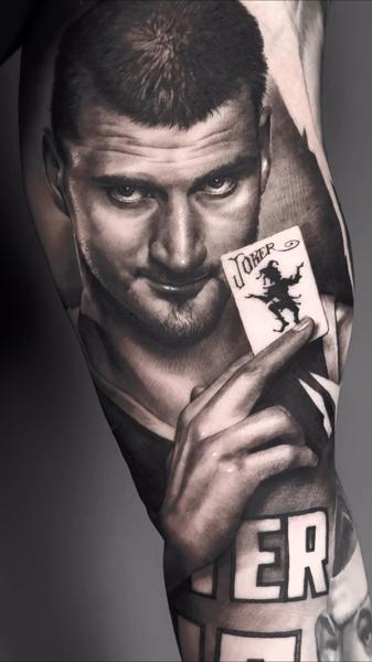 Realism joker card portrait tattoo by @a_dem_tattooartist