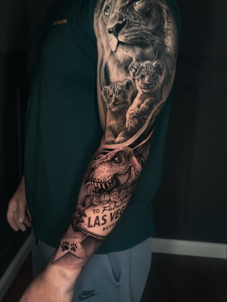 Realism lion and dinosaur tattoo by @a_dem_tattooartist
