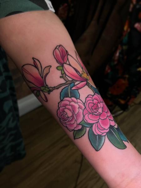 Illustrative magnolia roses tattoo by @abbiewilliamstattoo