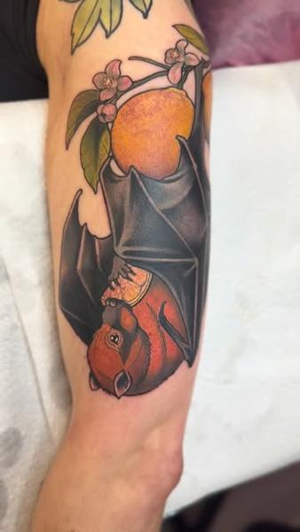 Realism bat with fruit tattoo by @abishroom_tattoos