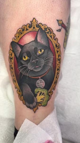 Traditional framed cat tattoo by @abishroom_tattoos