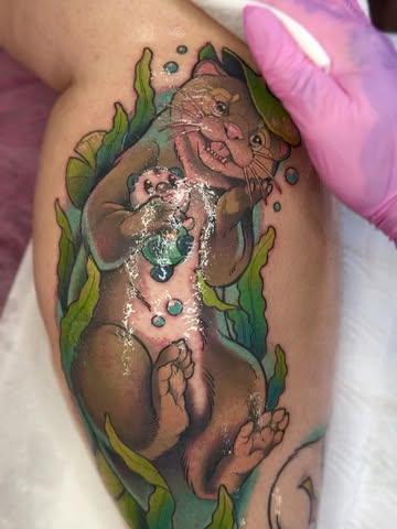 Illustrative playful otter tattoo by @abishroom_tattoos