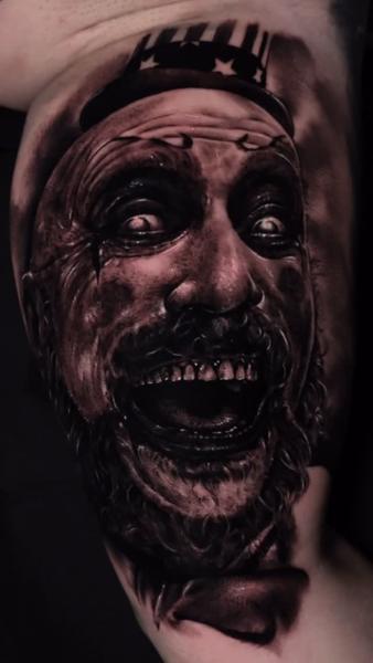 Realism creepy clown tattoo by @abraham.tattooist