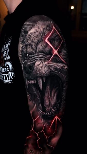 Realism snarling wolf tattoo by @abraham.tattooist