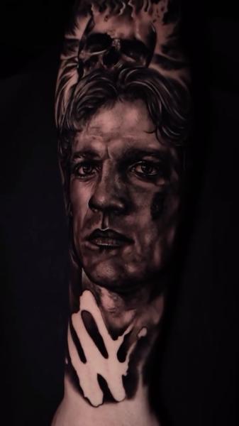 Realism portrait with skull tattoo by @abraham.tattooist
