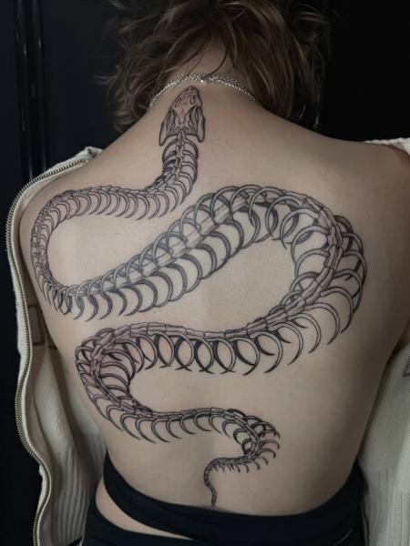Blackwork snake skeleton tattoo by @acidartist