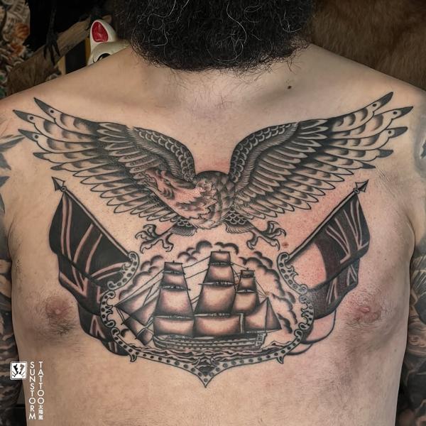 Traditional eagle and ship tattoo by @sunstormtattoo