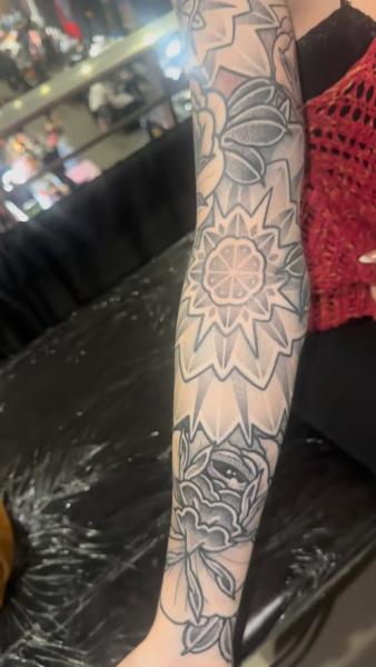 Blackwork geometric floral tattoo by @acrookedtattoo