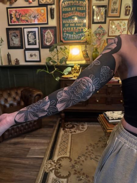 Blackwork floral sleeve tattoo by @acrookedtattoo