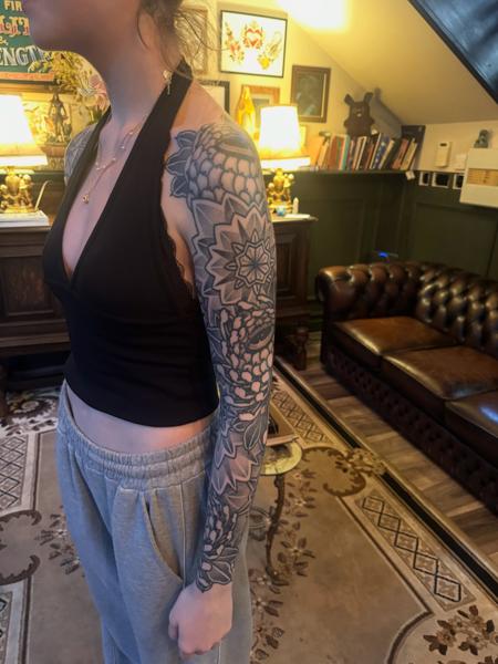 Blackwork geometric floral tattoo by @acrookedtattoo