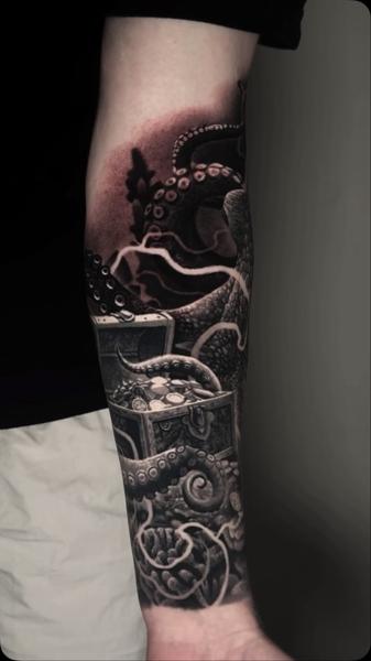 Realism octopus and treasure chest tattoo by @adamblakeytattoos