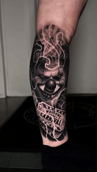 Realism creepy clown tattoo by @adamblakeytattoos