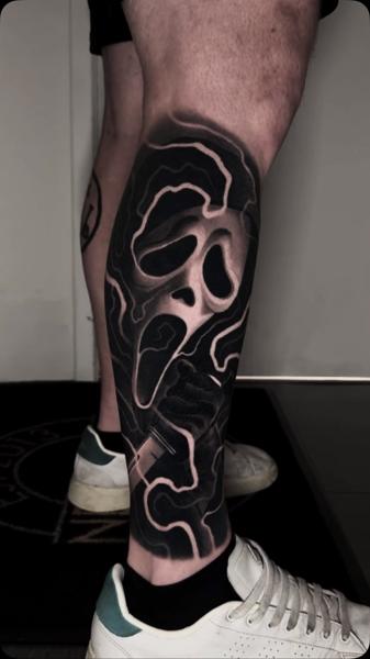 Blackwork scream mask tattoo by @adamblakeytattoos