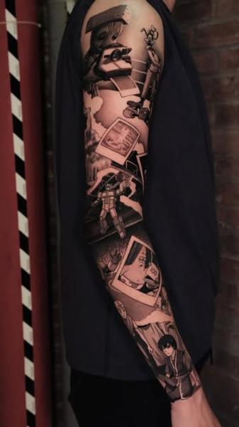 Illustrative black and grey pop culture polaroids tattoo by @adamdeanart