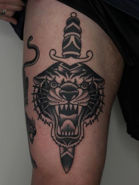 Traditional tiger dagger tattoo by @hudsontattoo