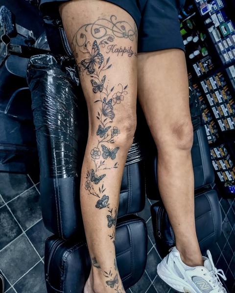 Fine line dotwork butterfly floral vine tattoo by @adsnowden_tattoo