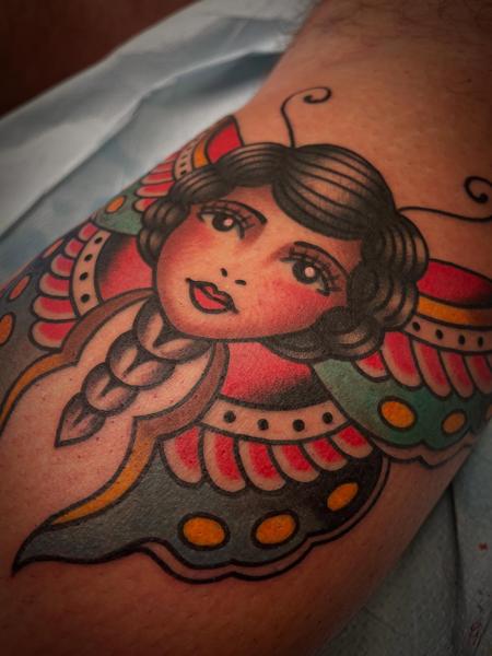 Traditional butterfly woman tattoo by @adamweir