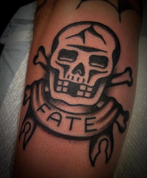 Traditional skull and crossbones tattoo by @adamweir