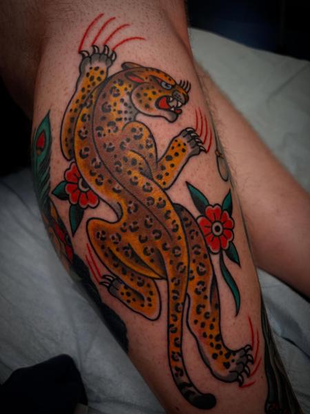 Traditional leopard tattoo by @adamweir