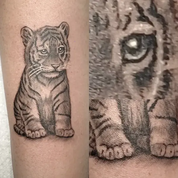 Realism tiger cub tattoo by @ade_truemantattoo