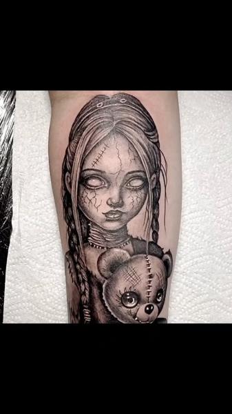 Realism creepy doll tattoo by @ade_truemantattoo