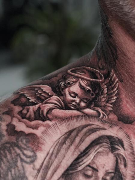 Realism cherub tattoo by @adtattoos