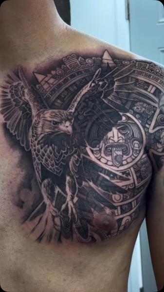 Realism eagle and aztec calendar tattoo by @adtattoos
