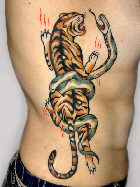 Traditional tiger and snake tattoo by @gk._tattoo