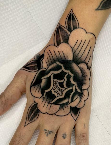 Traditional blackwork flower tattoo by @gk._tattoo