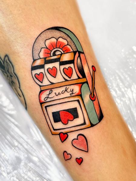 Traditional slot machine tattoo by @gk._tattoo