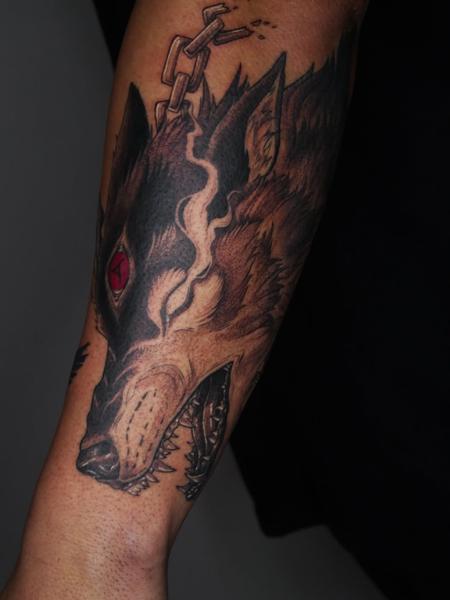 Illustrative chained wolf head tattoo by @angiek.tattoo