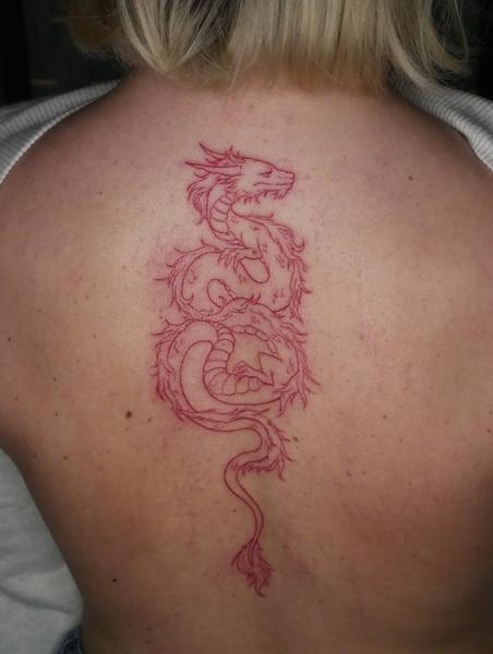 Oriental linework red dragon tattoo by @angiek.tattoo